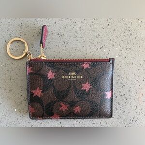 COACH Skinny ID in Brown Signature Print with Pink Stars